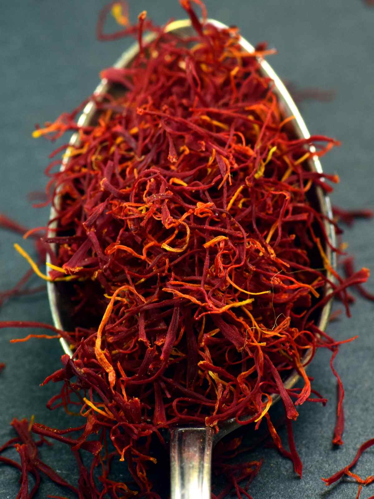 Saffron threads on a spoon.