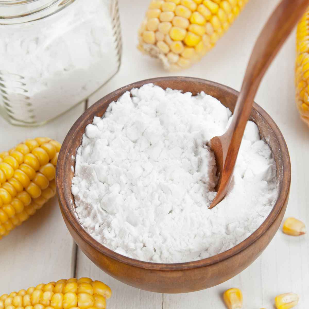 Corn flour in a wooden bowl.