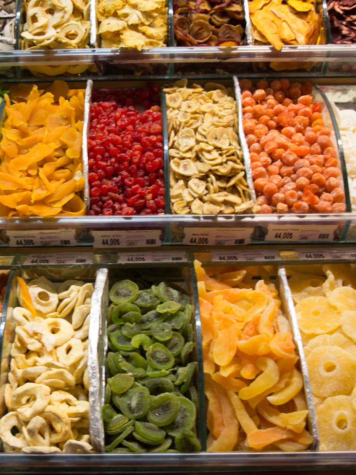 Assorted dry fruits placed in separate containers.