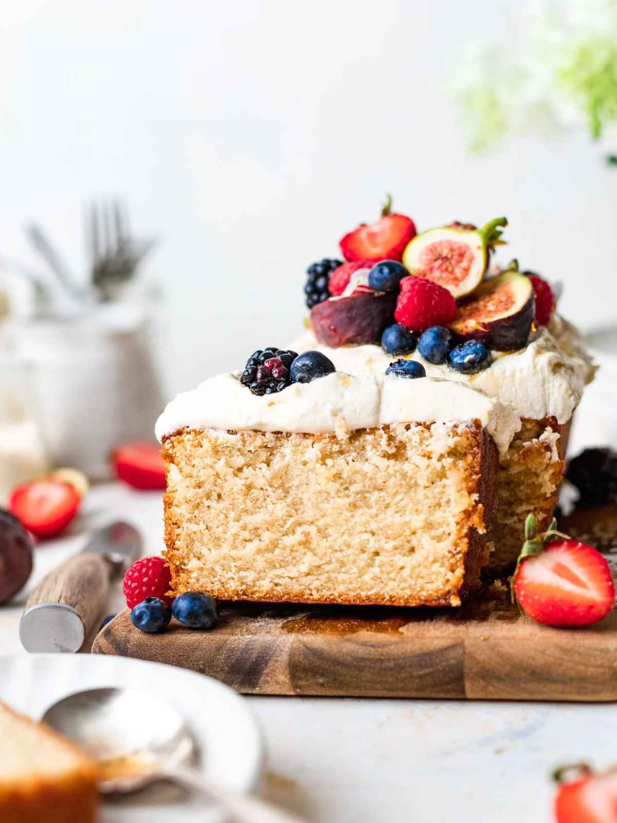 Vanilla pound cake topped with fresh fruit and icing.