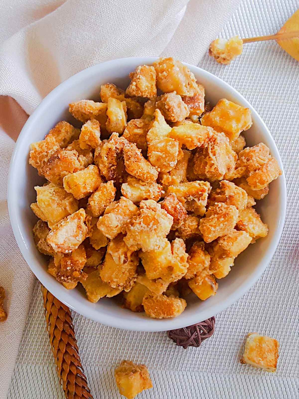 Salted caramel bread croutons served in a white bowl.