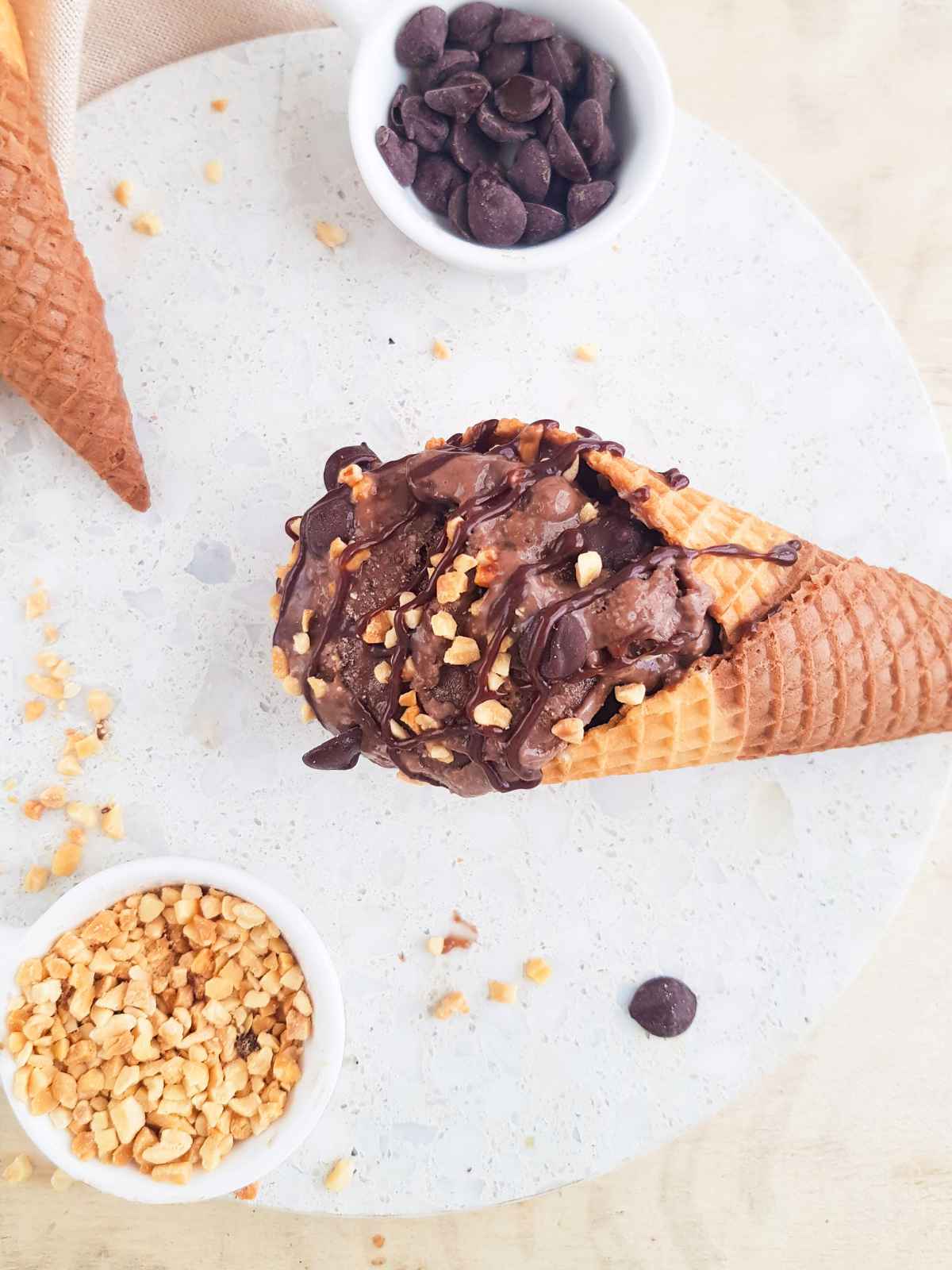 Chocolate nice cream served on a cone.