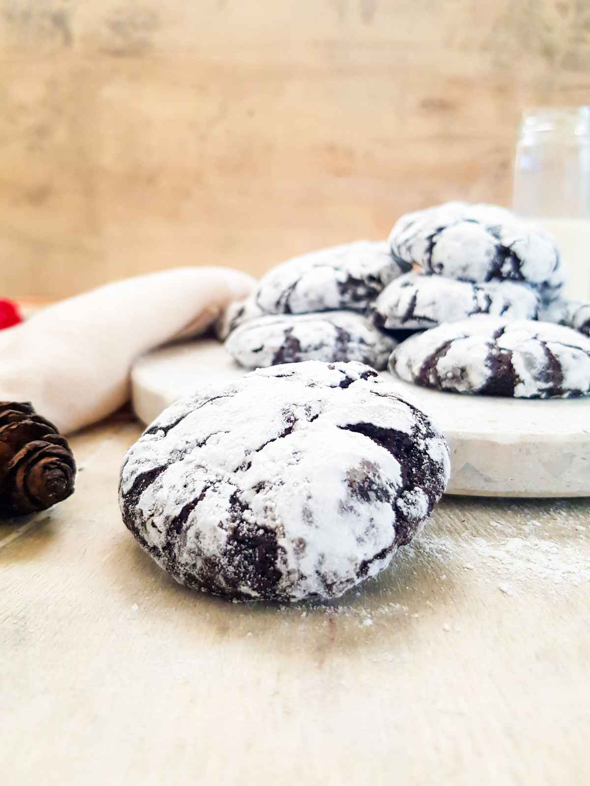 Vegan chocolate crinkle cookies stack.