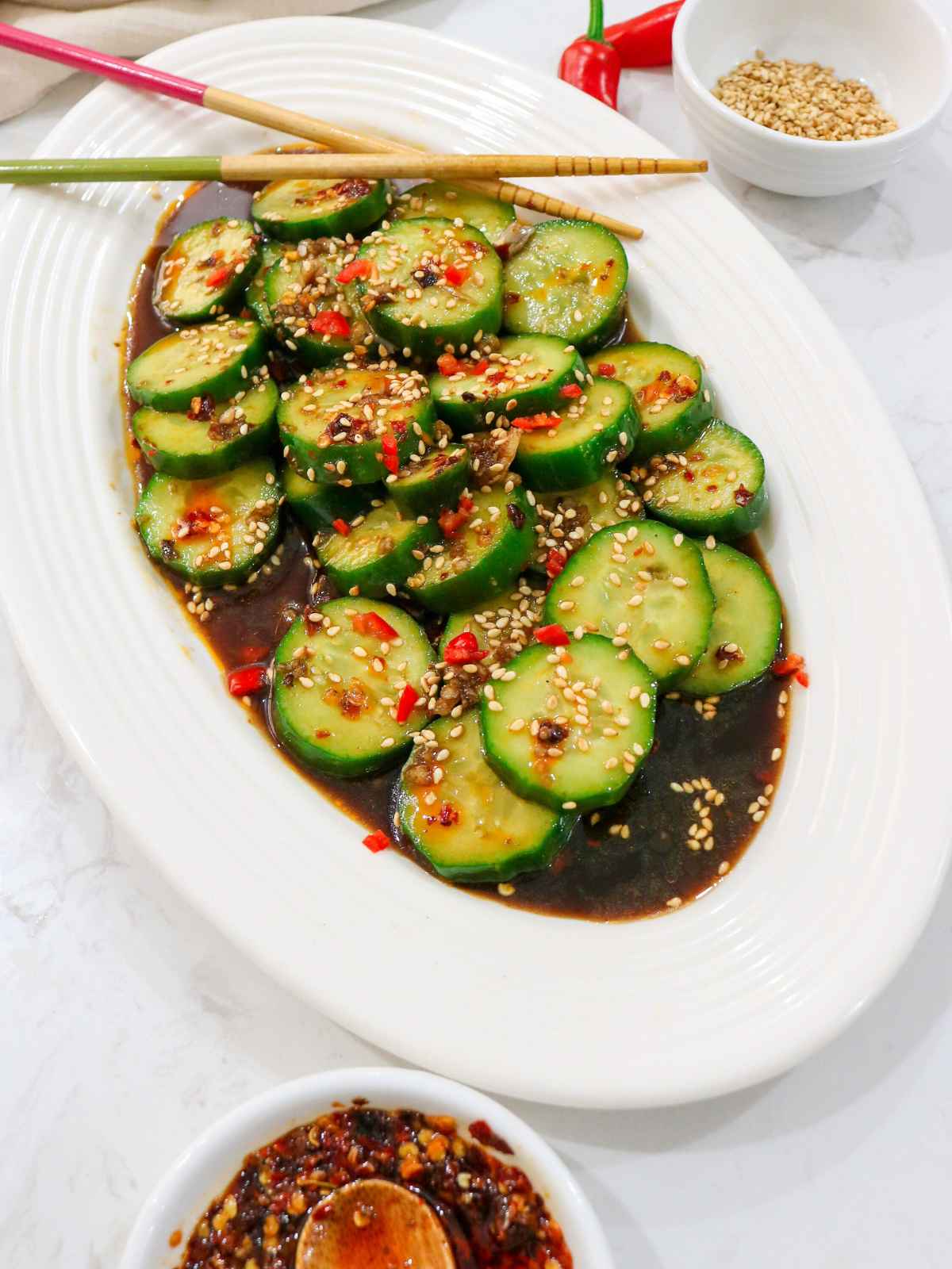 Din tai fung cucumber served in a white dish.