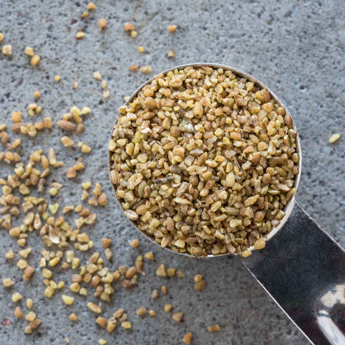 Anise seeds in a spoon.