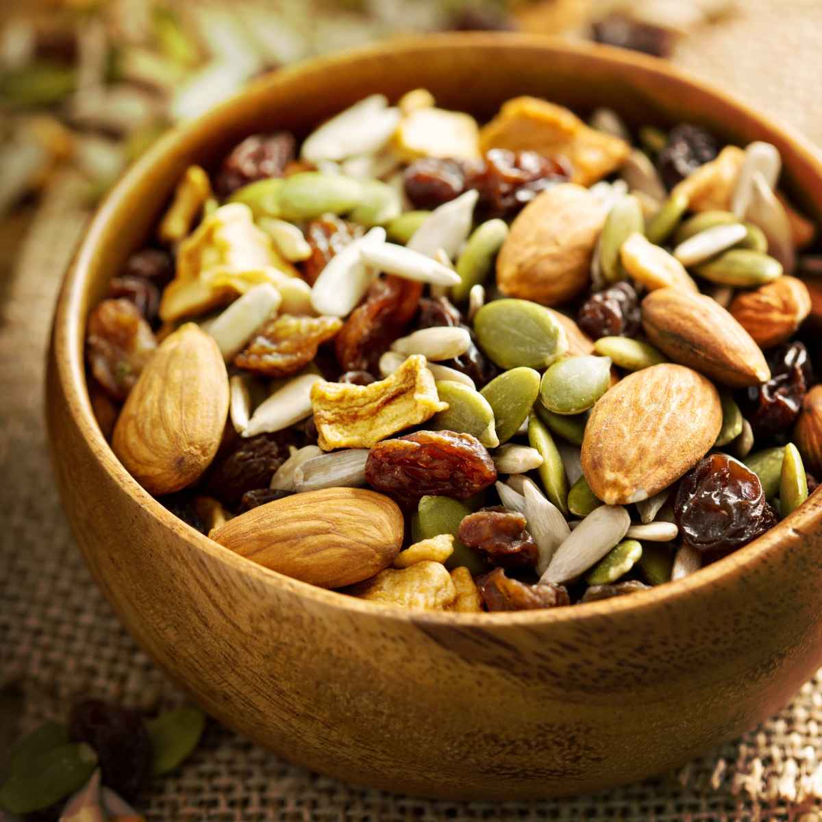 Nuts and seeds in a wooden bowl.