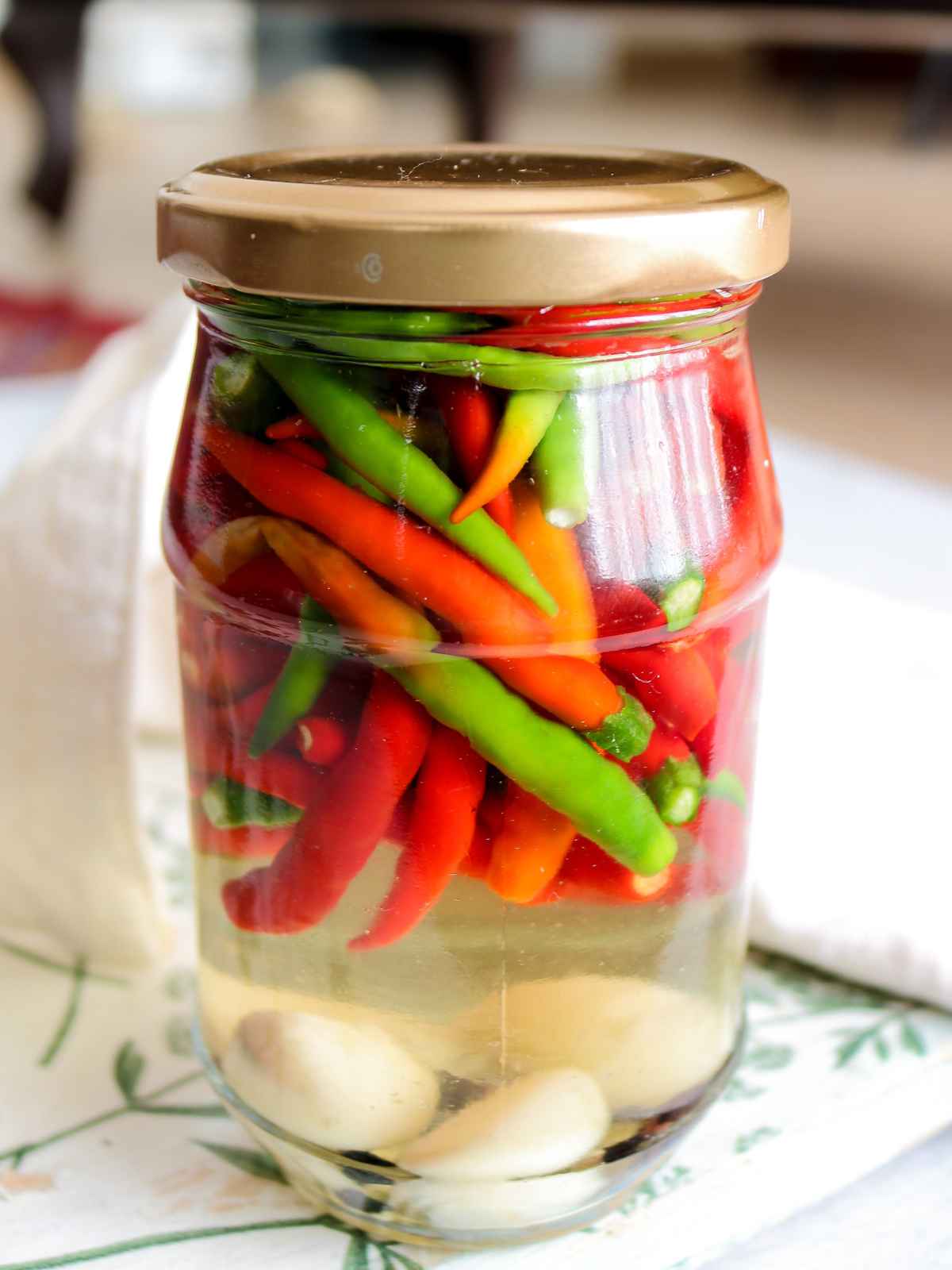 Storing chilli pickle in an air tight jar with the lid on.