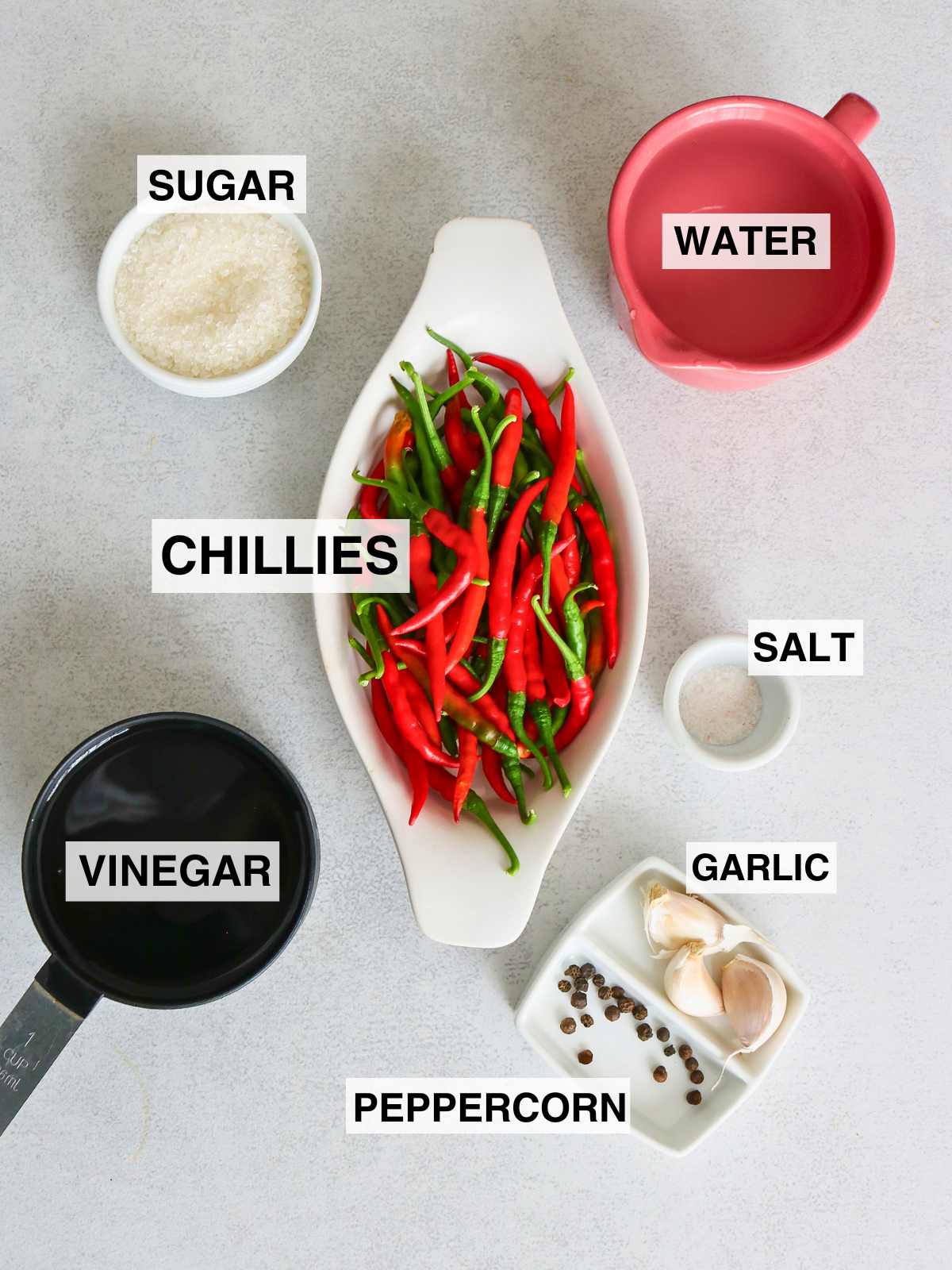 Tagged ingredients to make pickled chillies.